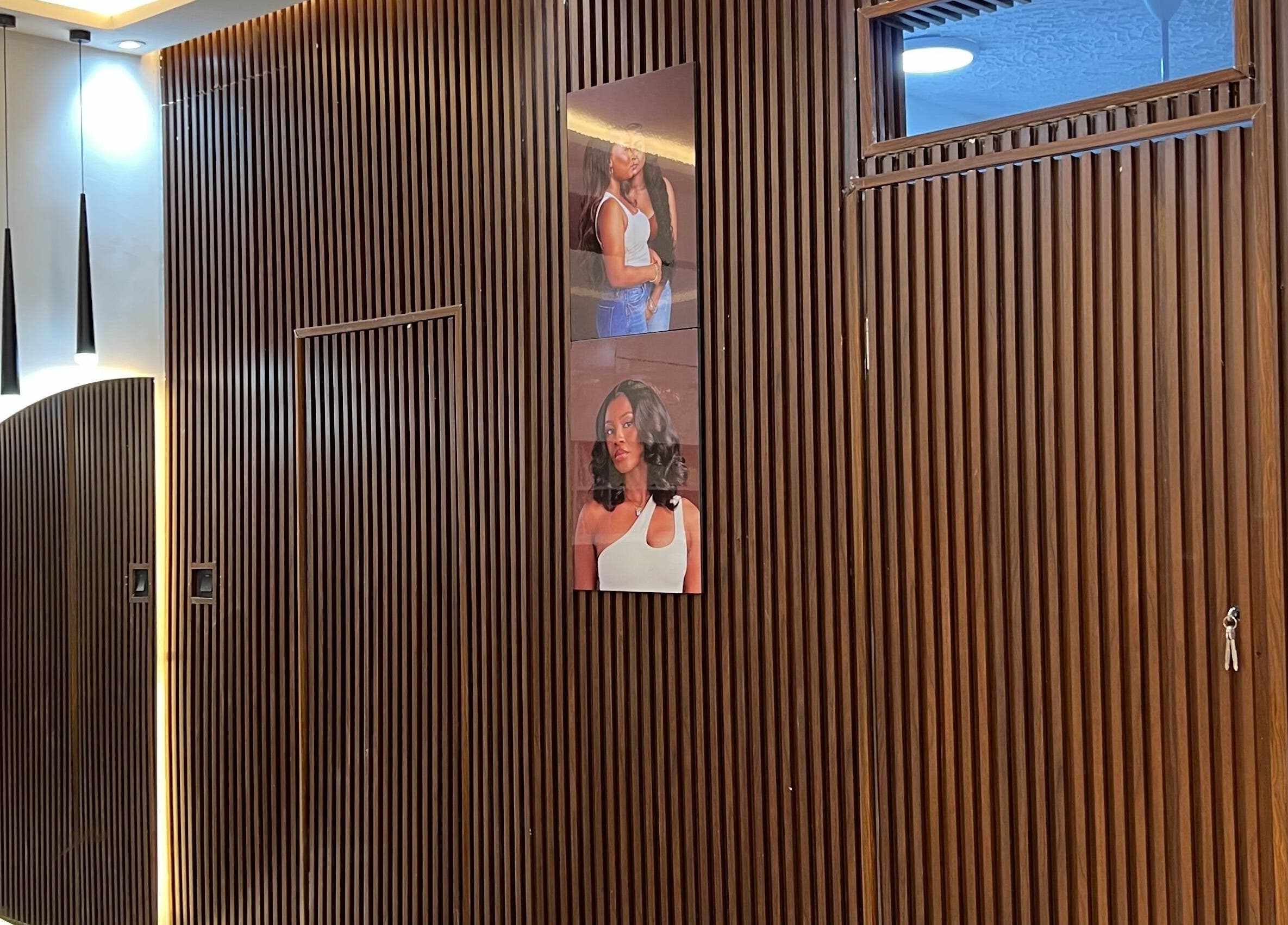 Stylish wooden wall with modern lighting at Wighub & Salon, Accra, Greater Accra Region, GH.