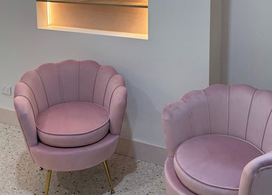 Chic pink chairs at Lash & Brows Palace, Clarkson, Western Australia, AU, offering modern elegance.