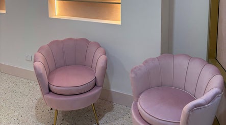 Chic pink chairs at Lash & Brows Palace, Clarkson, Western Australia, AU, offering modern elegance.