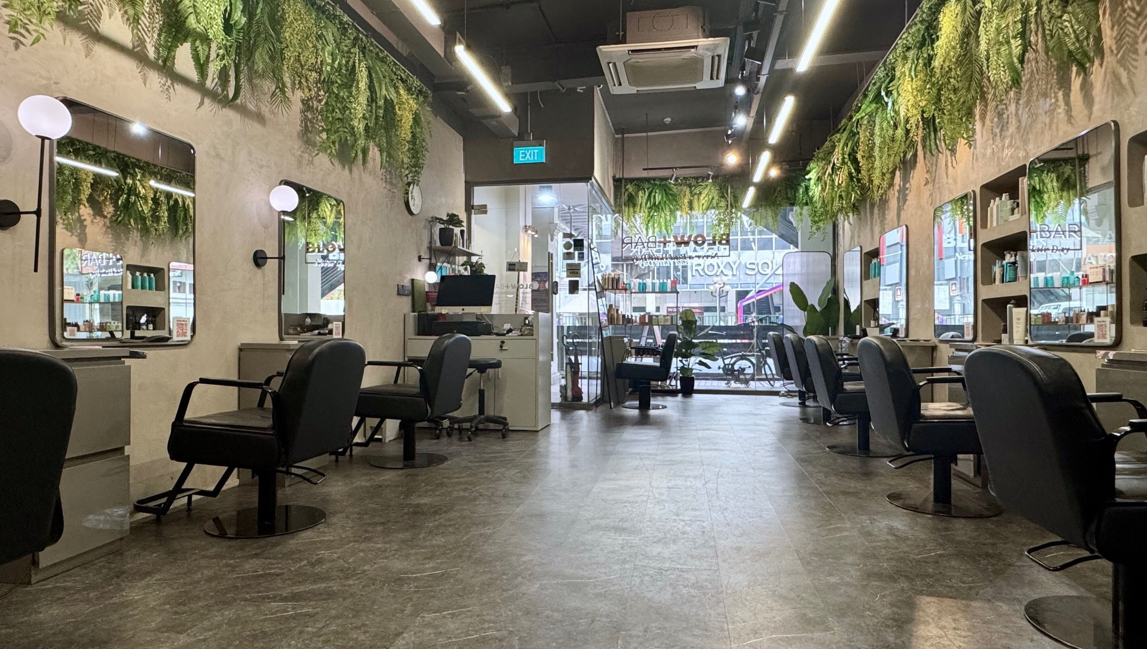 Modern salon interior with lush greenery at Blow+Bar in Singapore, Singapore, SG.