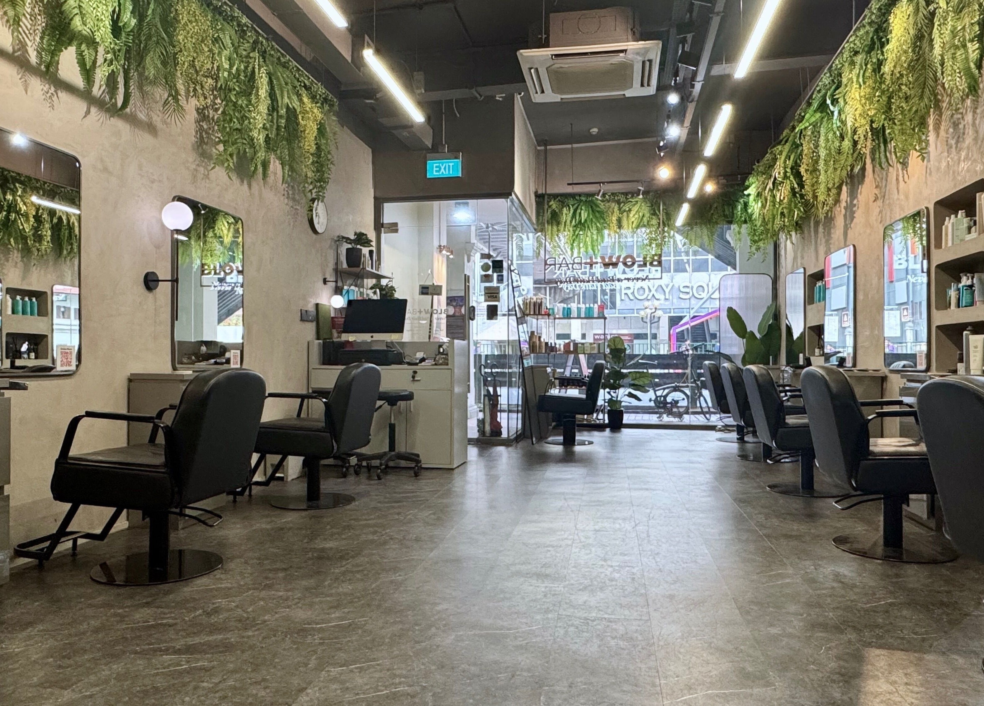 Modern salon interior with lush greenery at Blow+Bar in Singapore, Singapore, SG.
