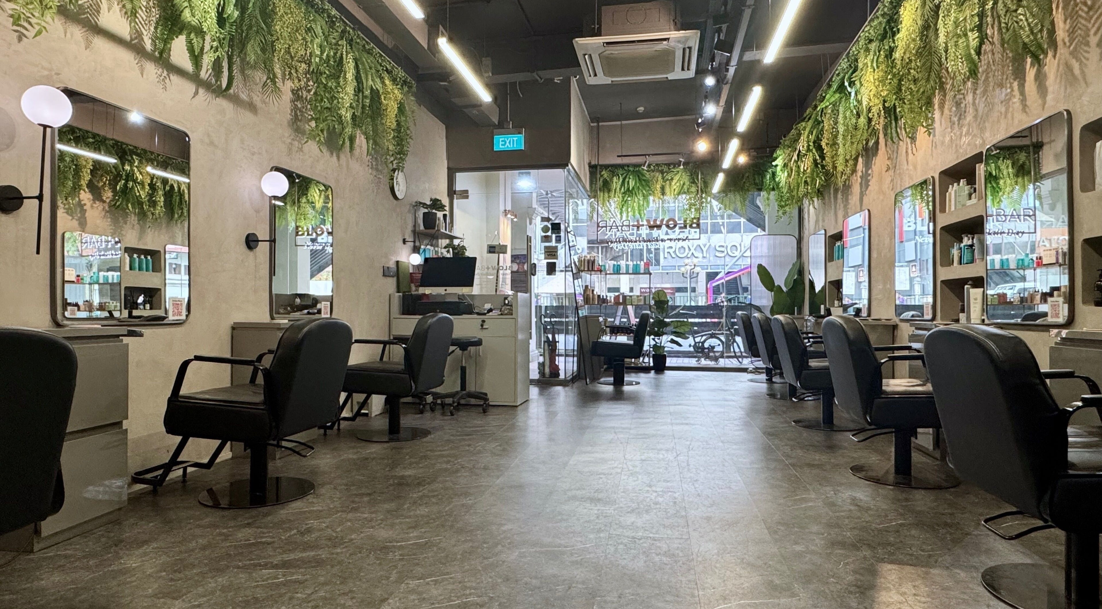 Modern salon interior with lush greenery at Blow+Bar in Singapore, Singapore, SG.