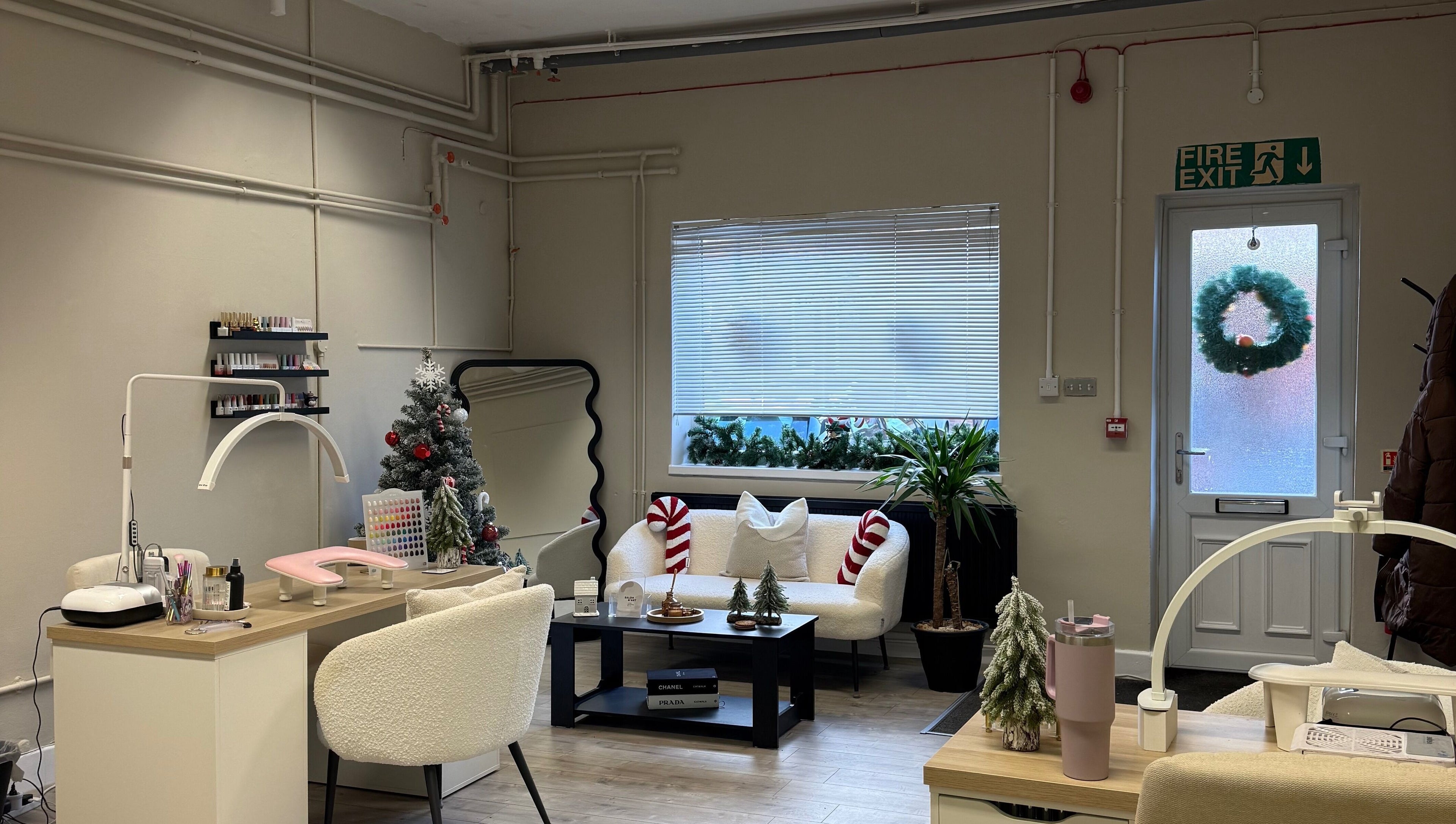 Festive interior of Lashes by Katie in Nantwich, England, GB, featuring chic decor and comfortable seating.