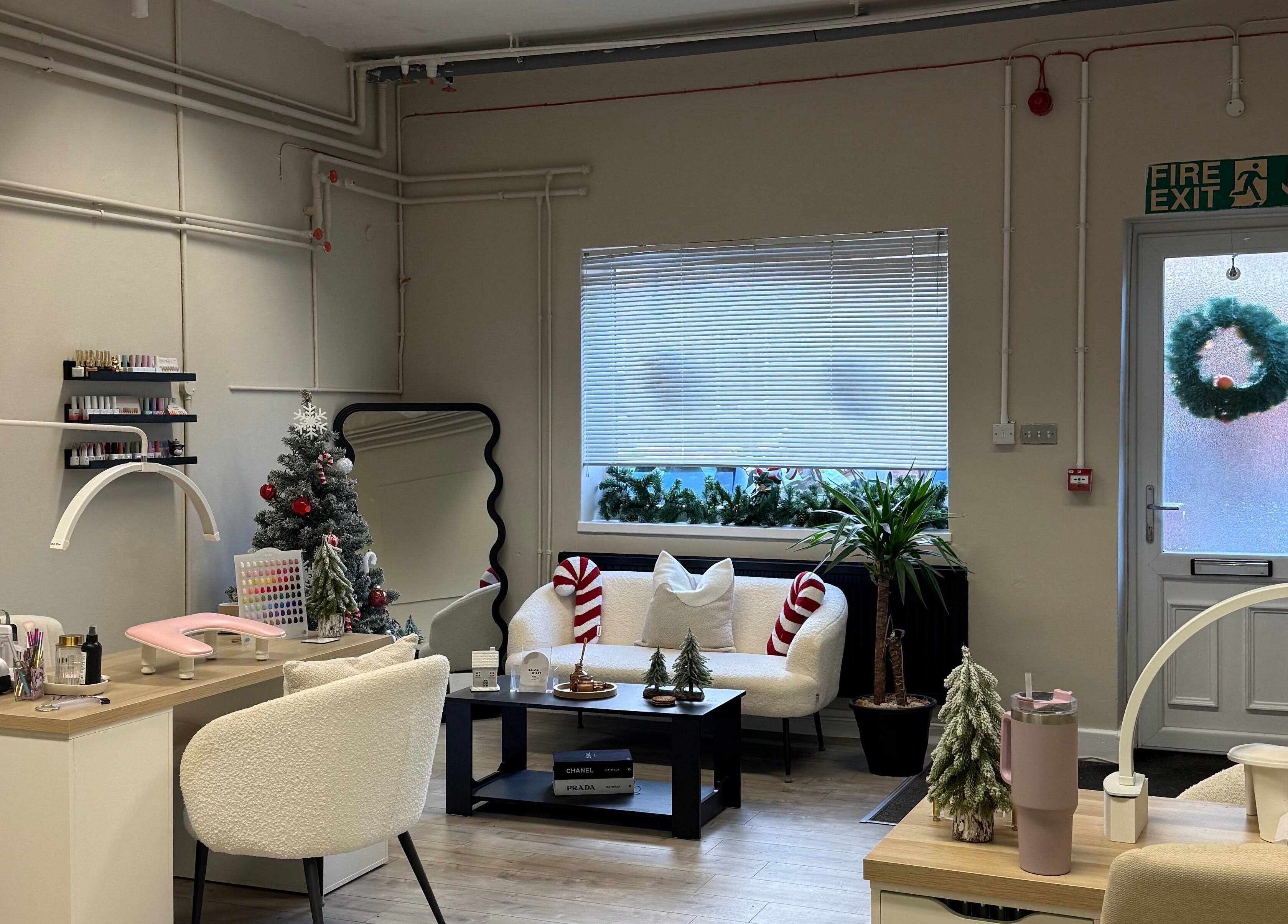 Festive interior of Lashes by Katie in Nantwich, England, GB, featuring chic decor and comfortable seating.