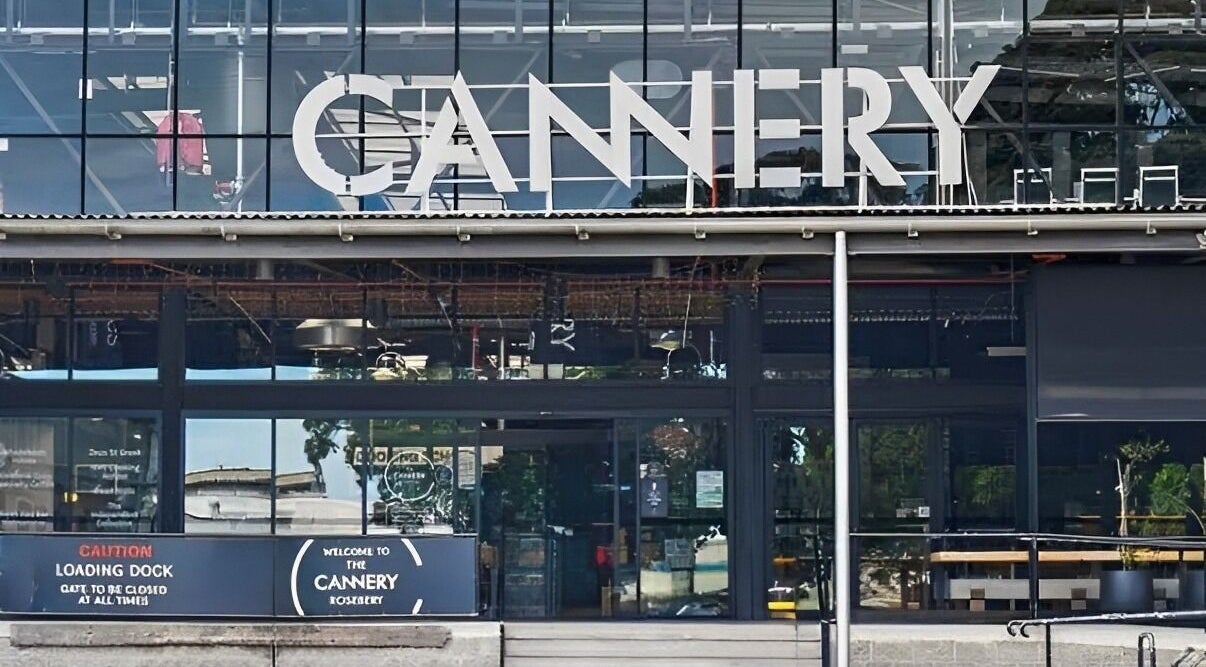 Facade of Tapperdon Barbershop at Cannery in Rosebery, New South Wales, AU, showcasing modern architecture.