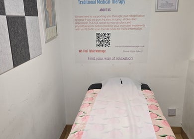 Tranquil therapy room at WS Thai Table Massage in Croydon, England, GB, featuring a peach-patterned massage table.