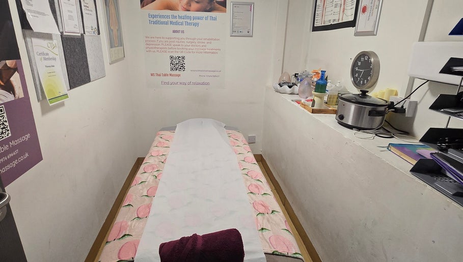 Serene massage room at WS Thai Table Massage, Croydon, England, GB, showcasing a comfortable therapy setting.