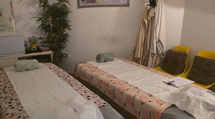 Relaxing massage room at WS Thai Table Massage, Croydon, England, GB with massage beds and serene decor.