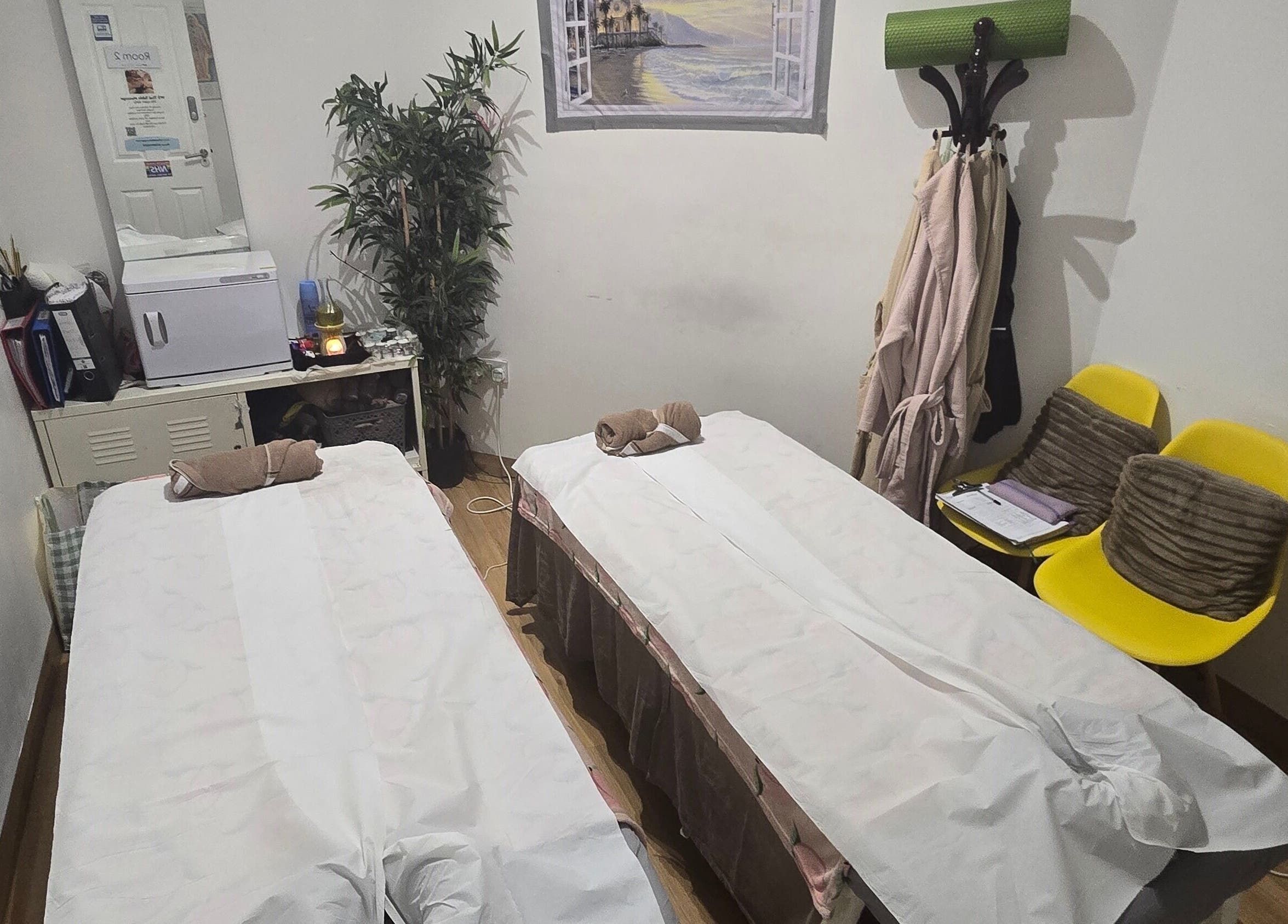 Relaxing double massage room at WS Thai Table Massage, Croydon, England, GB featuring two treatment beds.