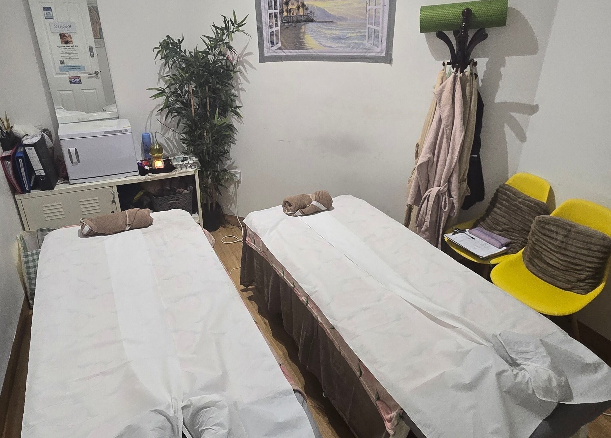 Relaxing double massage room at WS Thai Table Massage, Croydon, England, GB featuring two treatment beds.