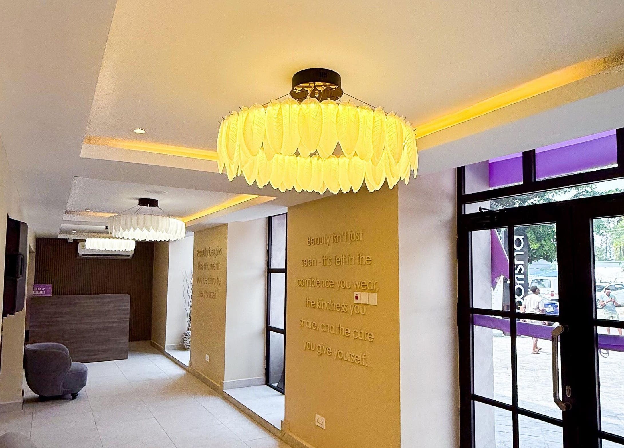 Elegant entrance of Polish’d Nails and Beauty Bar in Accra, Greater Accra Region, GH with modern lighting.