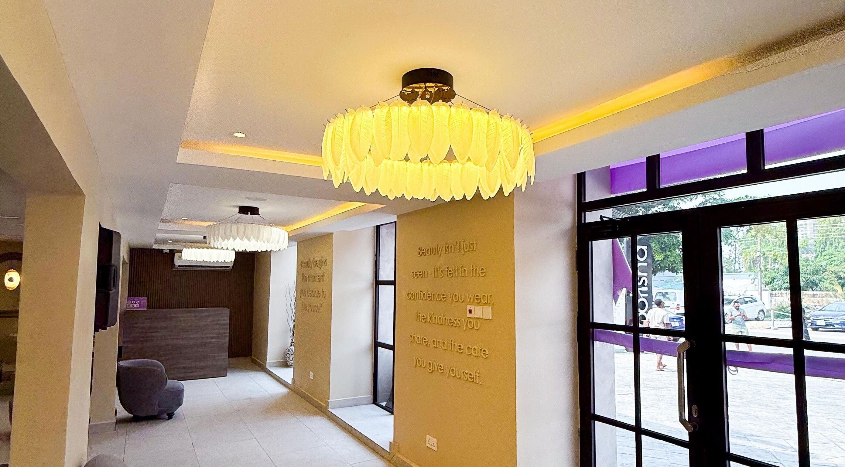 Elegant entrance of Polish’d Nails and Beauty Bar in Accra, Greater Accra Region, GH with modern lighting.