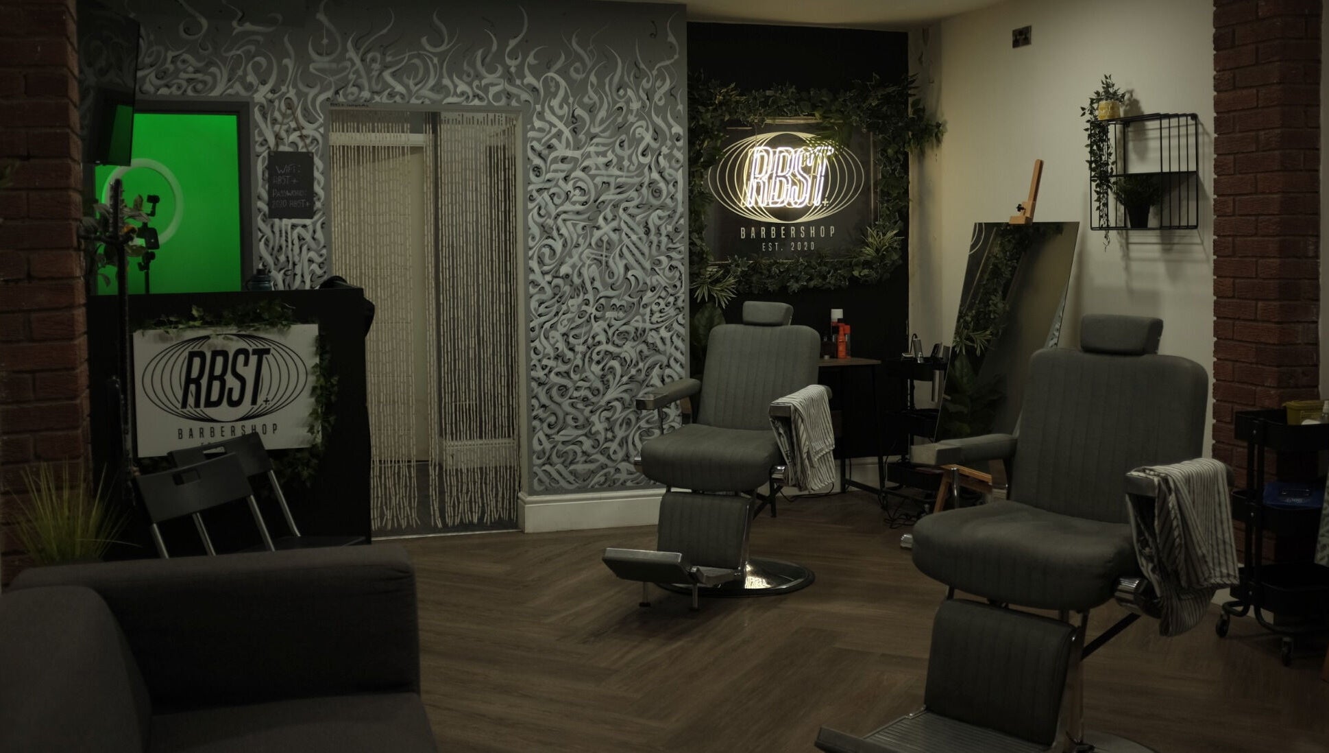 Interior of RBST+ Barber Shop in Horwich, England, GB featuring modern chairs and stylish decor.