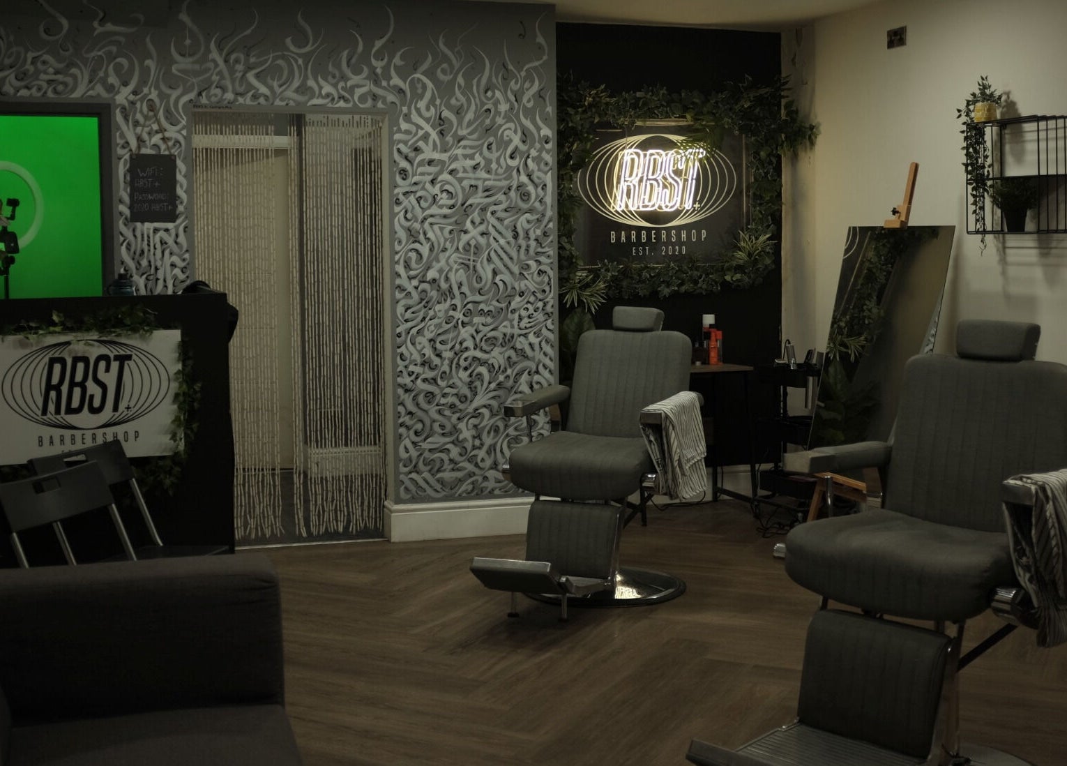 Interior of RBST+ Barber Shop in Horwich, England, GB featuring modern chairs and stylish decor.