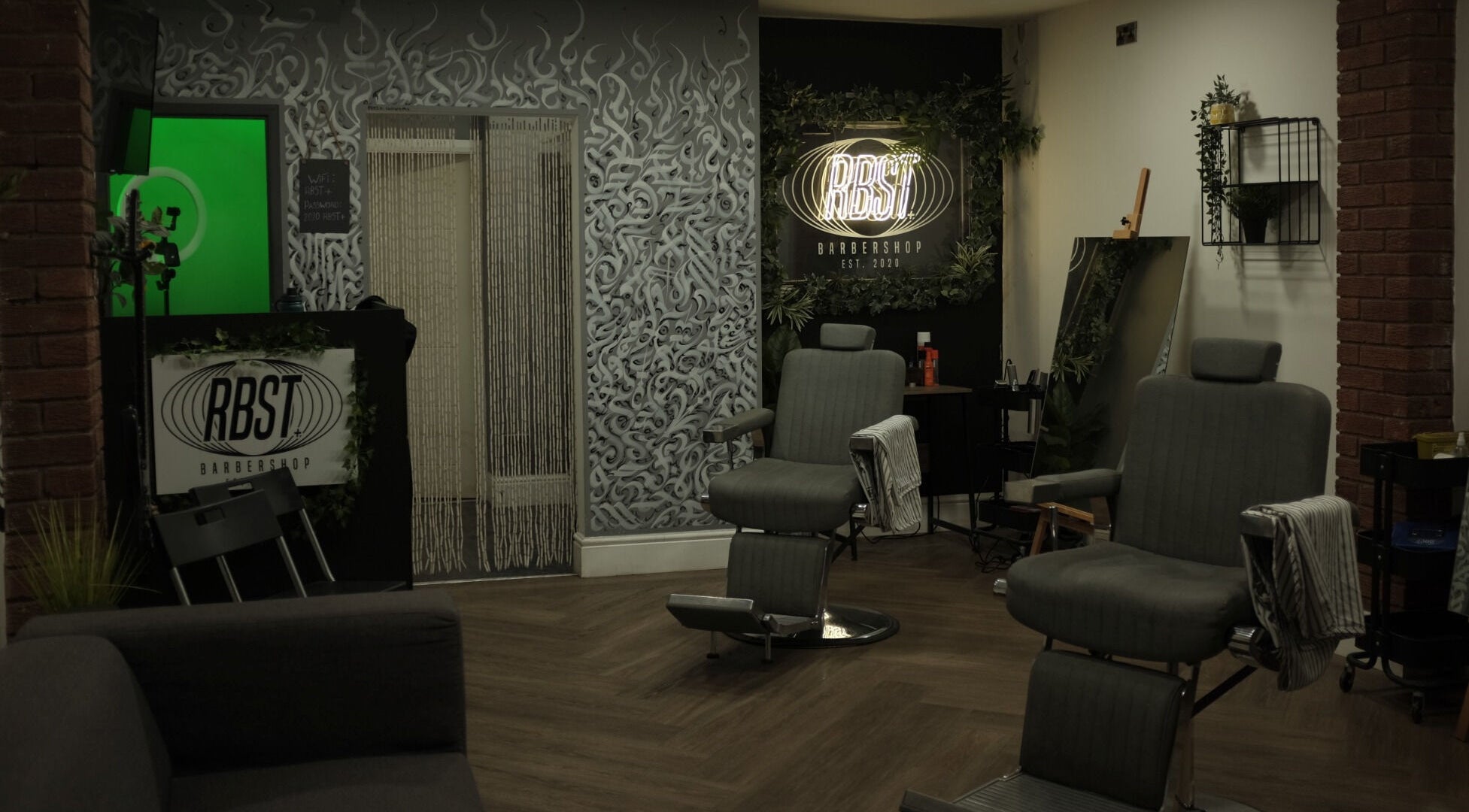 Interior of RBST+ Barber Shop in Horwich, England, GB featuring modern chairs and stylish decor.