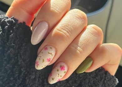 Floral nail art design at Burjuwanails in Lyndhurst, New Jersey, US. Elegant multi-colored manicure.