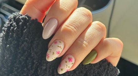 Floral nail art design at Burjuwanails in Lyndhurst, New Jersey, US. Elegant multi-colored manicure.