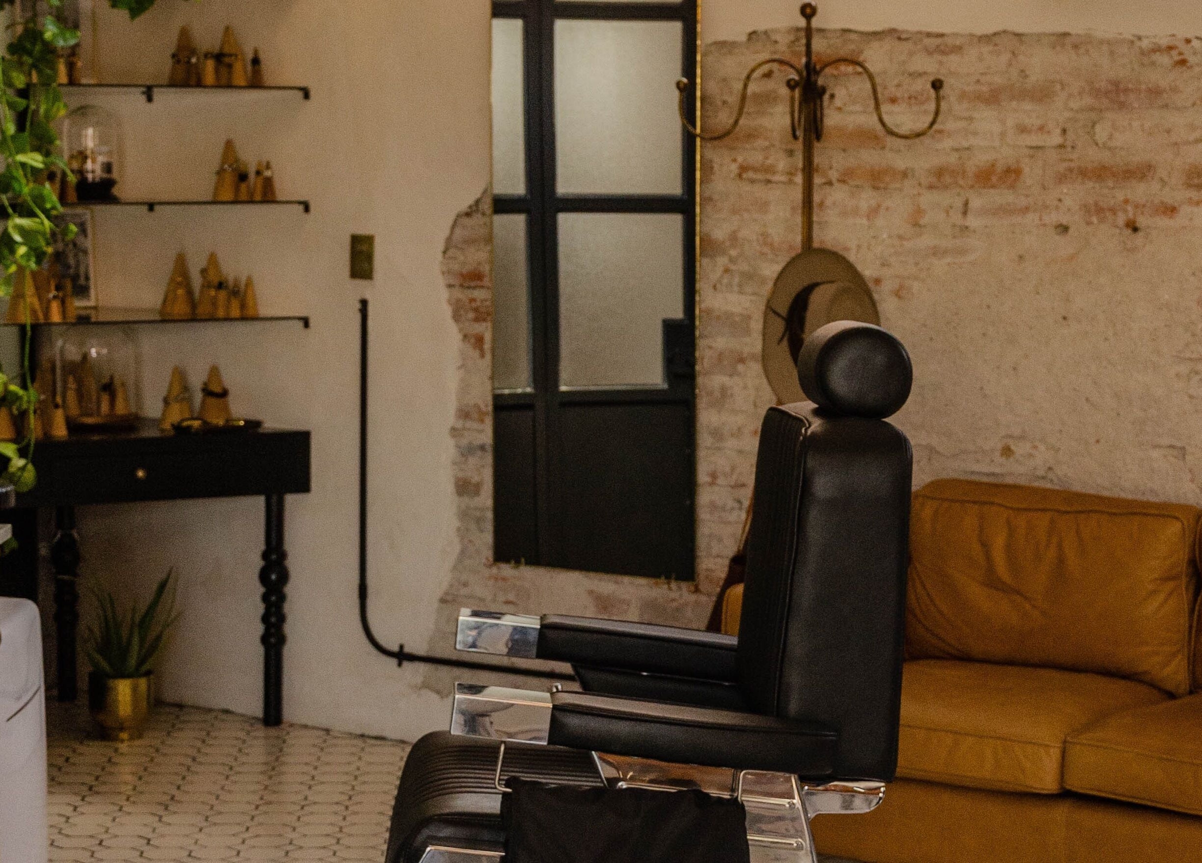 Cozy salon interior at VILLANO SAN MIGUEL, San Miguel De Allende features a vintage chair and elegant decor.