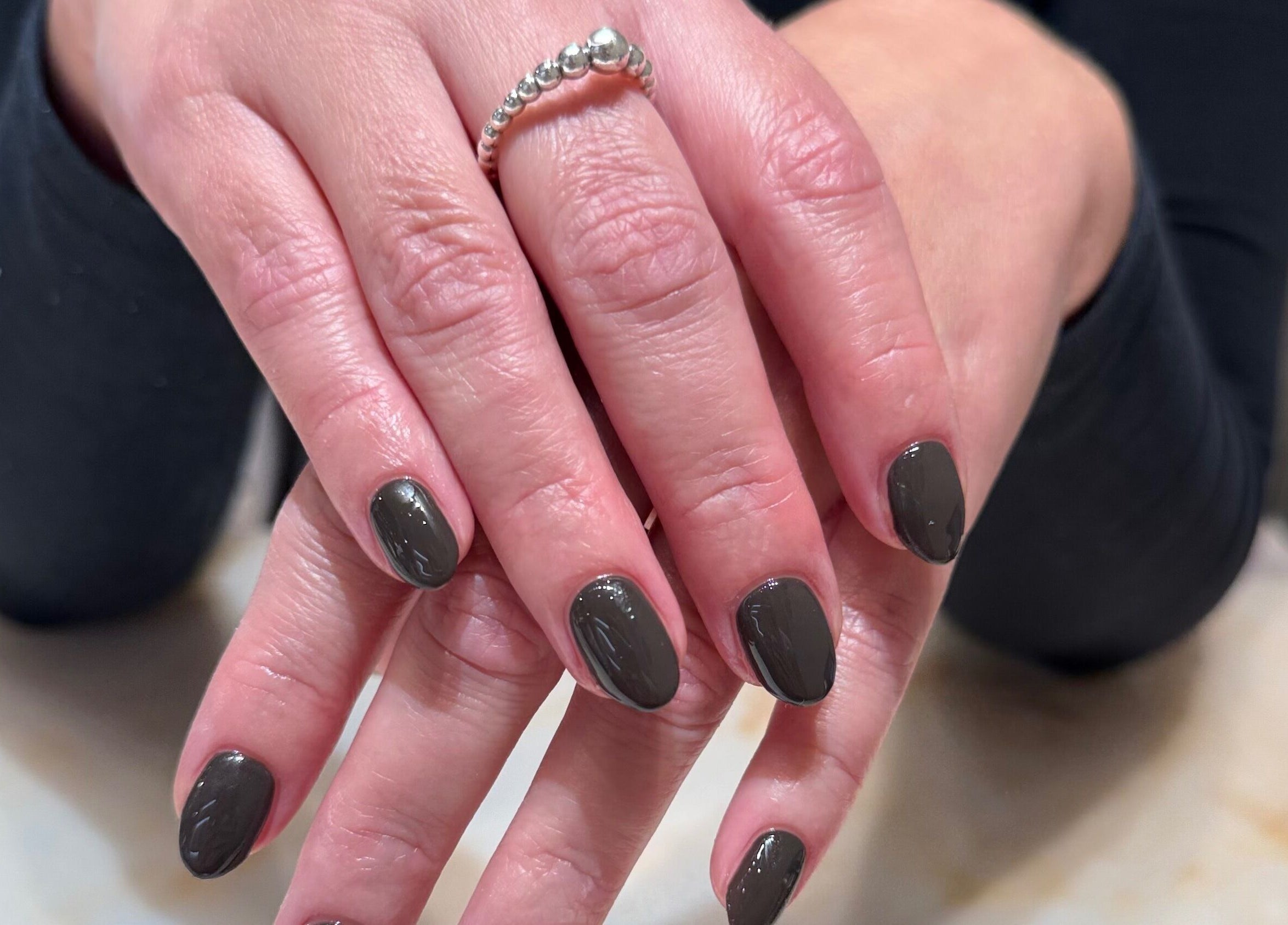 Manicured hands with polished nails at Solie Studios, Bristol, England, GB.