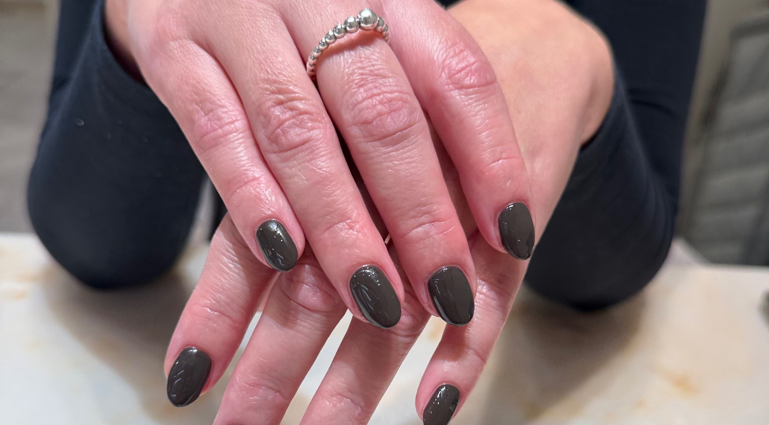 Manicured hands with polished nails at Solie Studios, Bristol, England, GB.