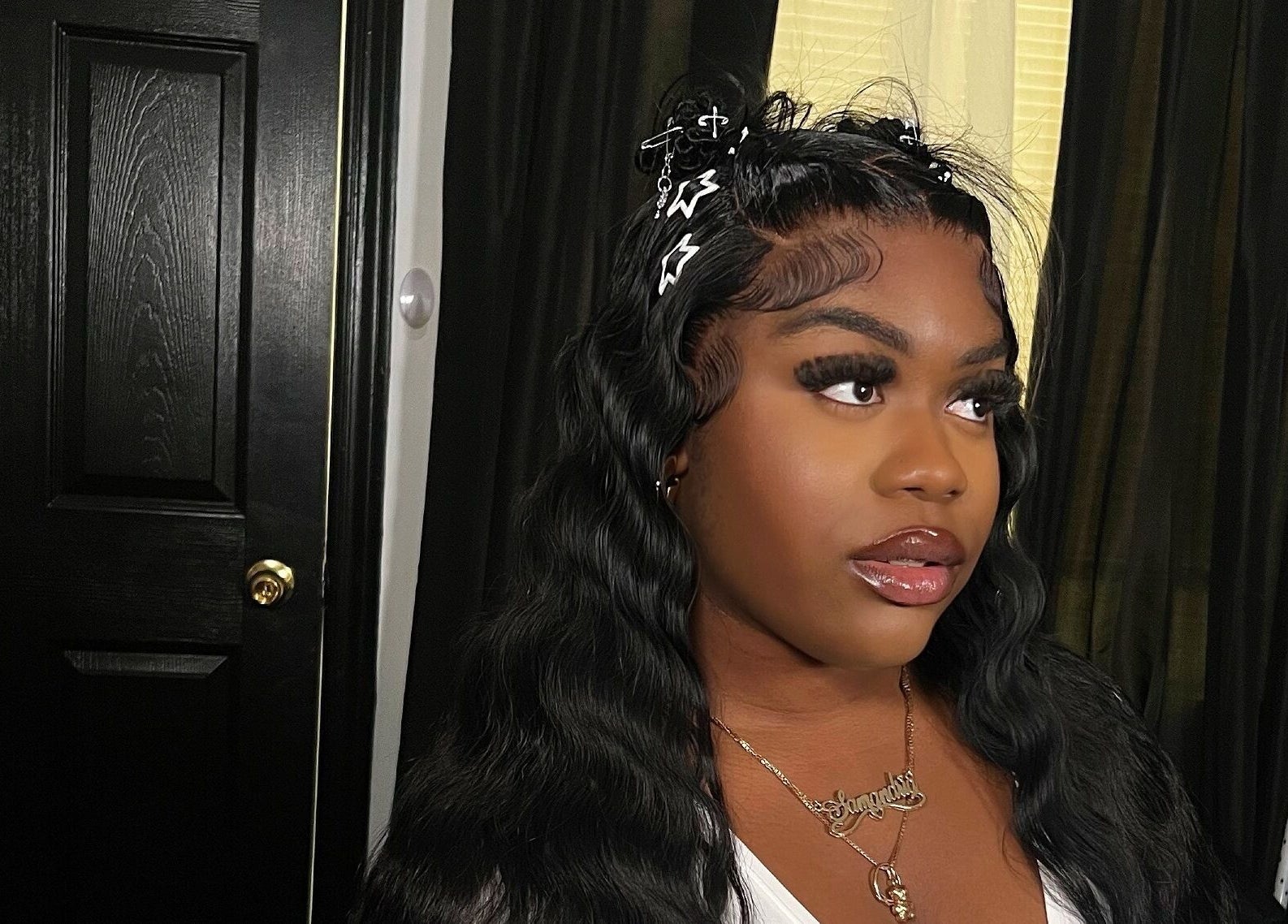 A woman with styled hair at Misfits HQ, Vaughan, Ontario, CA showcasing beauty services.