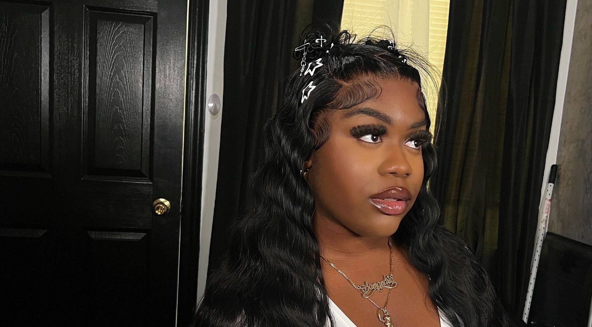 A woman with styled hair at Misfits HQ, Vaughan, Ontario, CA showcasing beauty services.