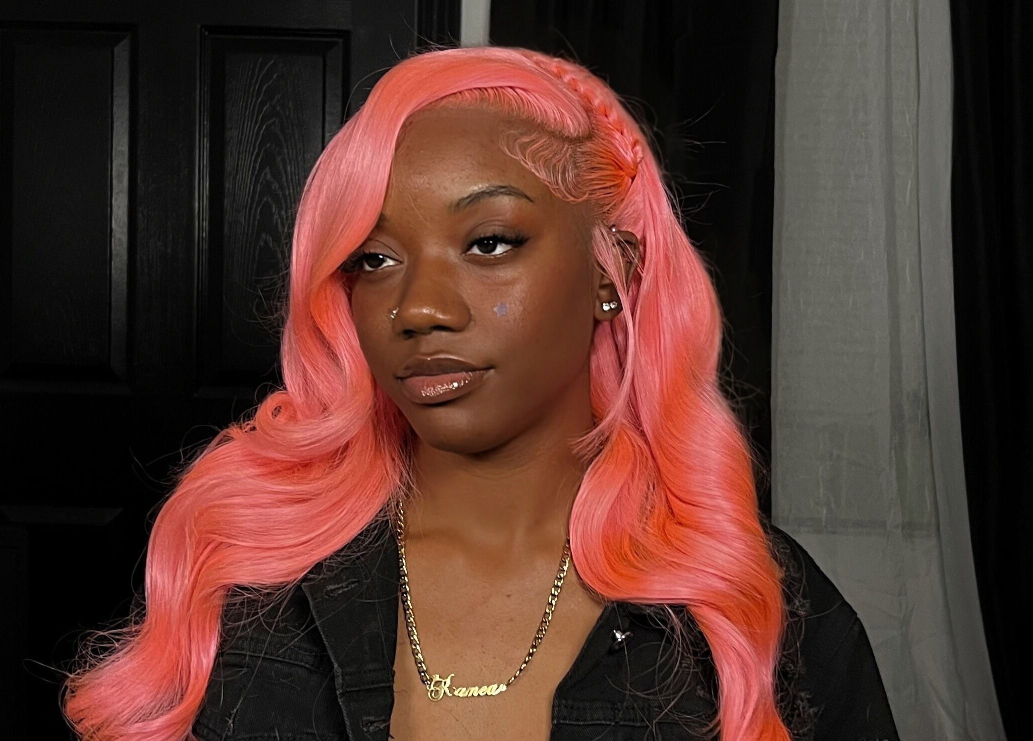 Woman with vibrant pink hair at Misfits HQ, Vaughan, Ontario, CA. Stylish braid and glossy look.