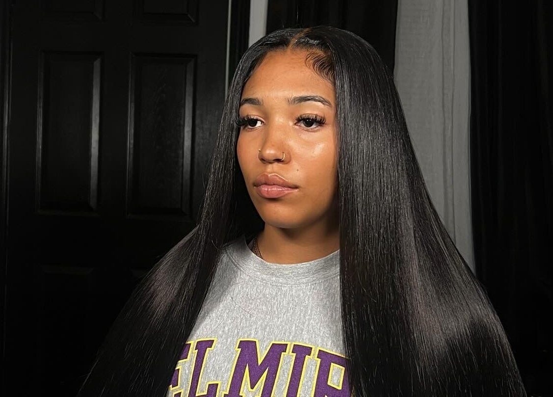 Model with smooth straight hair at Misfits HQ in Vaughan, Ontario, CA, showcasing professional hairstyling.