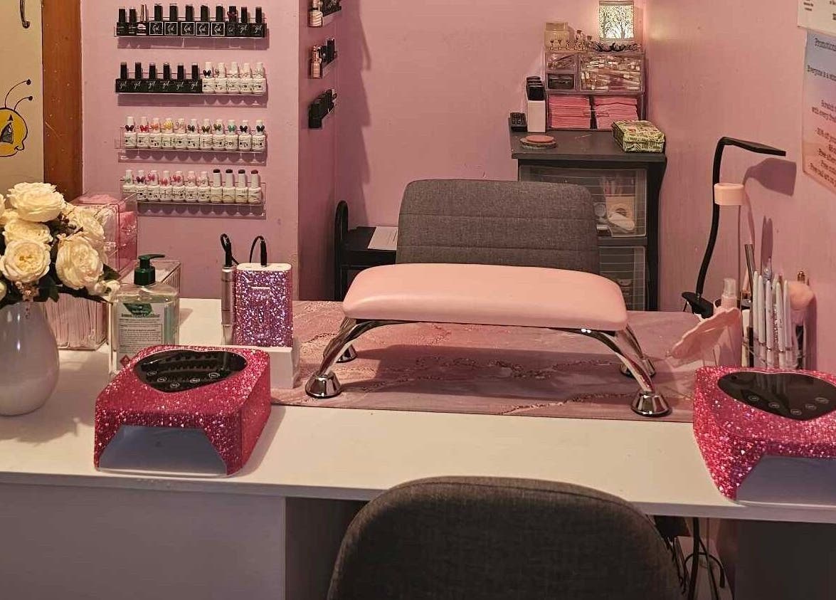Chic nail setup at Glam Nails by Immie in Invercargill, Southland, NZ with pink accents and floral decor.
