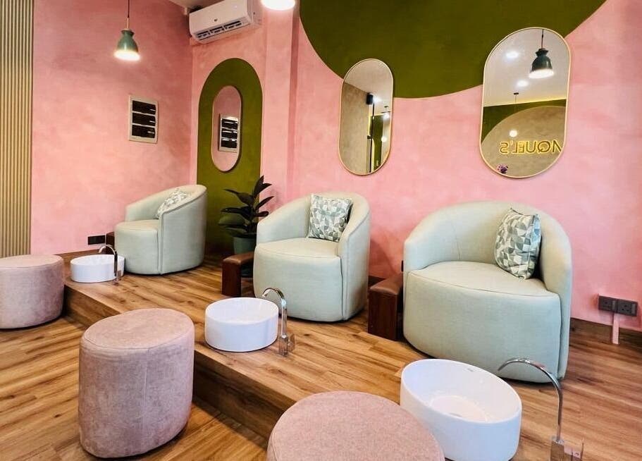 Elegant pedicure chairs at Raquel's Wennappuwa in Wennappuwa, North Western Province, LK with chic decor.