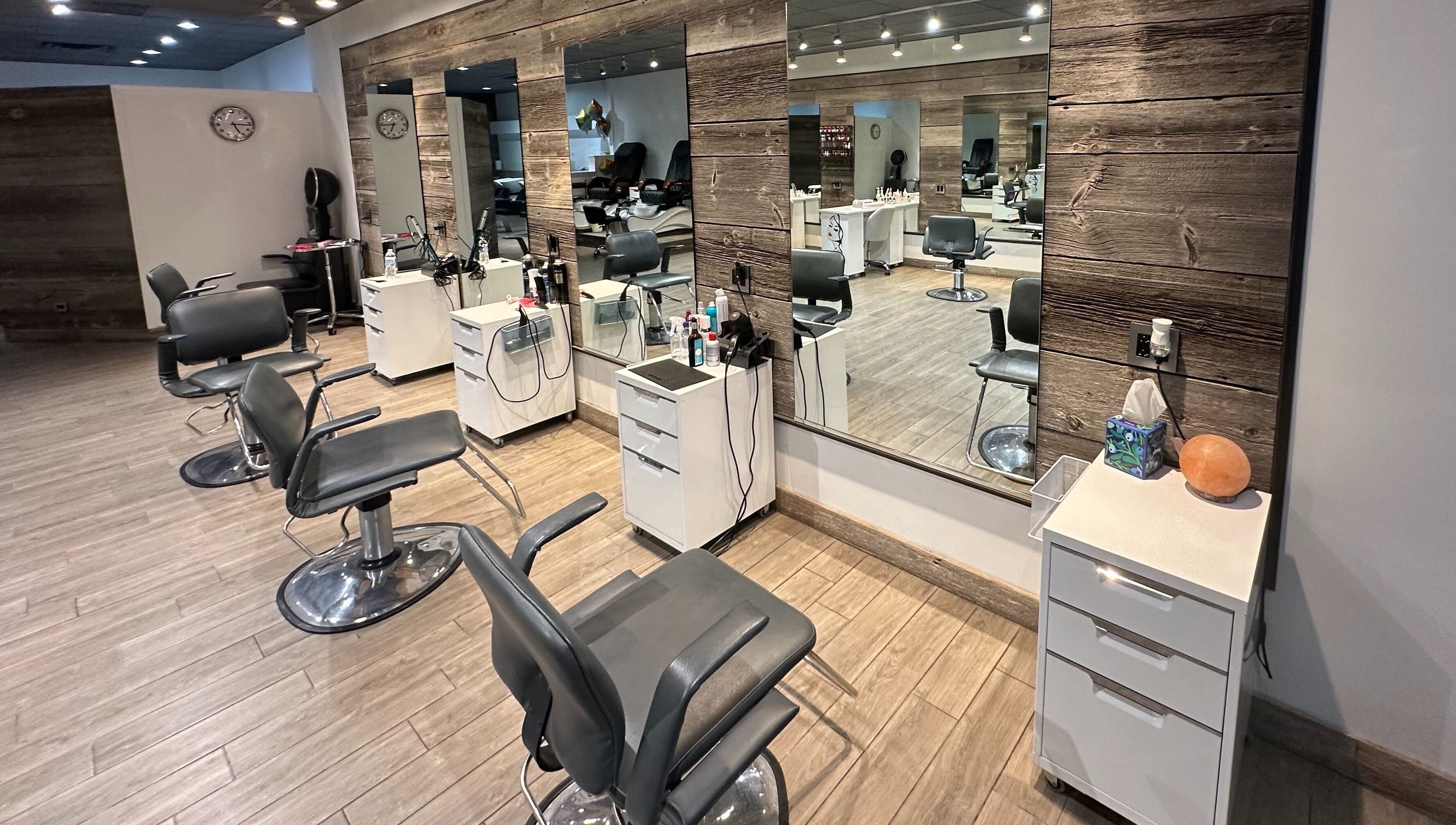 Modern salon chairs and mirrors at Eda Salon&Spa, Chicago, Illinois, US, showcasing stylish interior design.