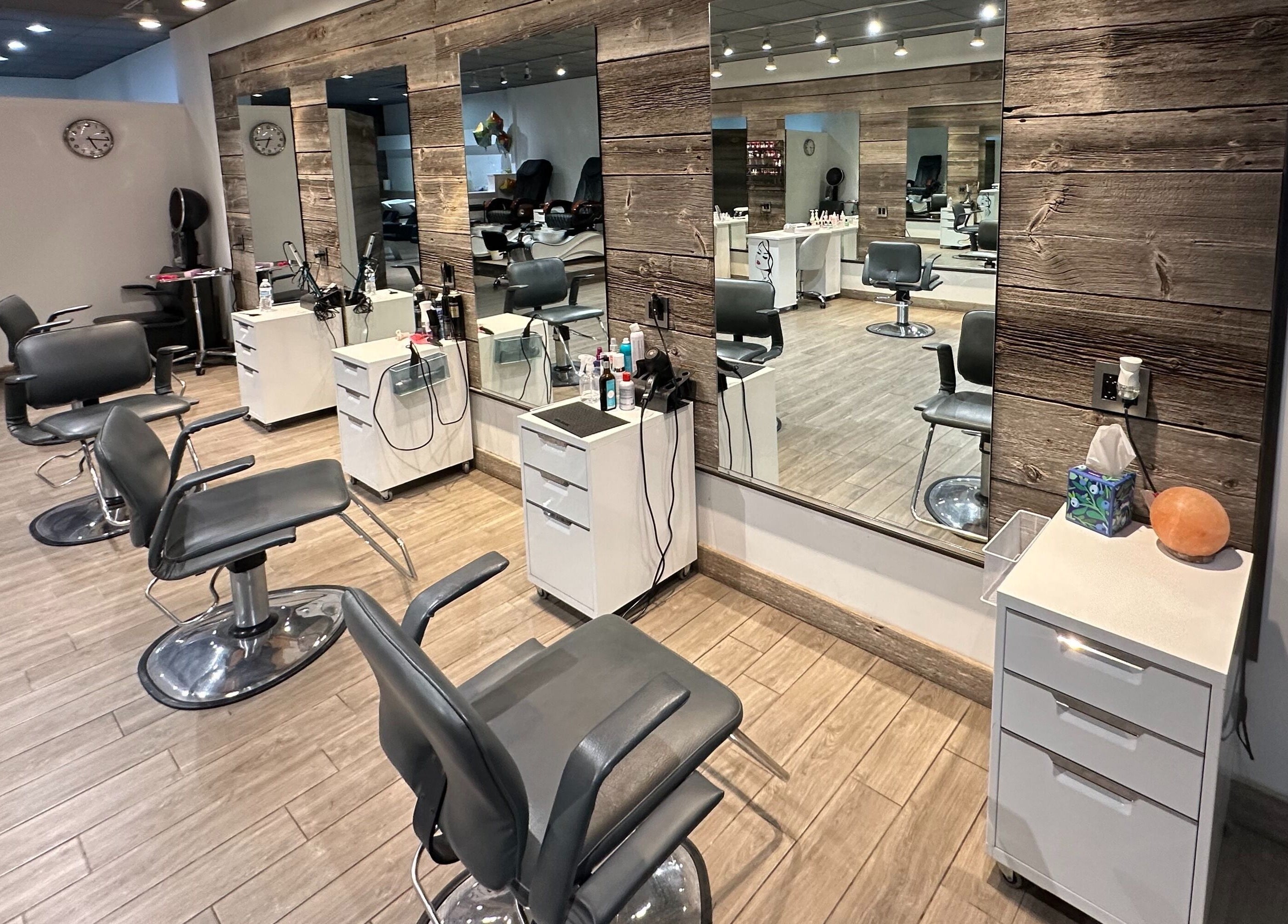 Modern salon chairs and mirrors at Eda Salon&Spa, Chicago, Illinois, US, showcasing stylish interior design.