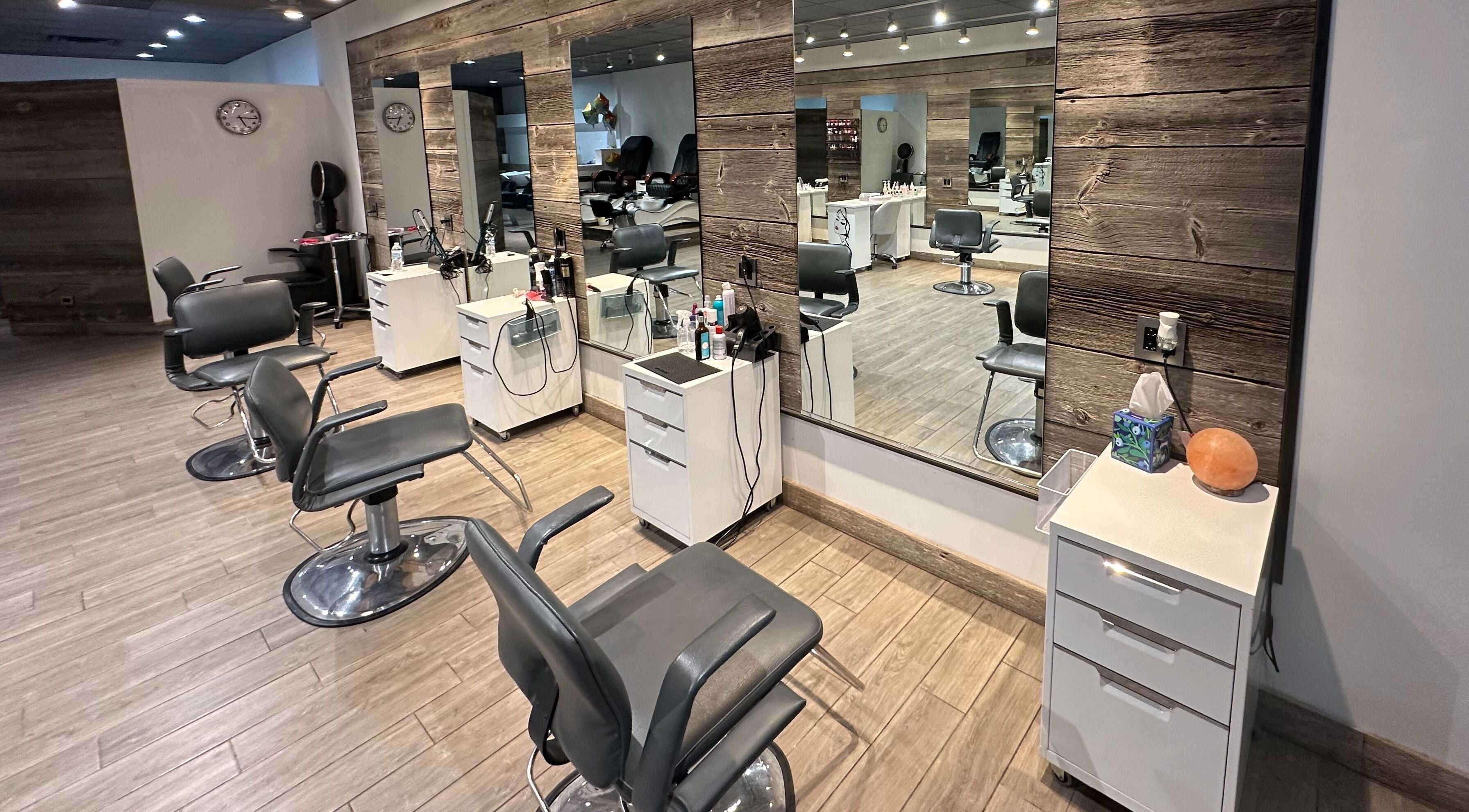 Modern salon chairs and mirrors at Eda Salon&Spa, Chicago, Illinois, US, showcasing stylish interior design.