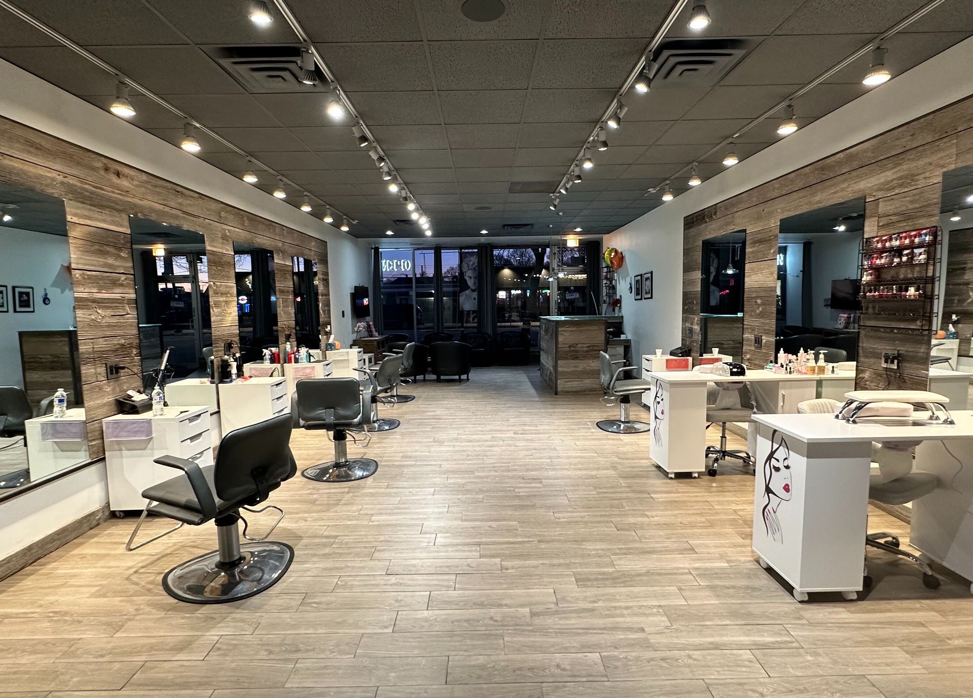 Chic interior of Eda Salon&Spa in Chicago, Illinois, US with modern styling stations and elegant mirrors.