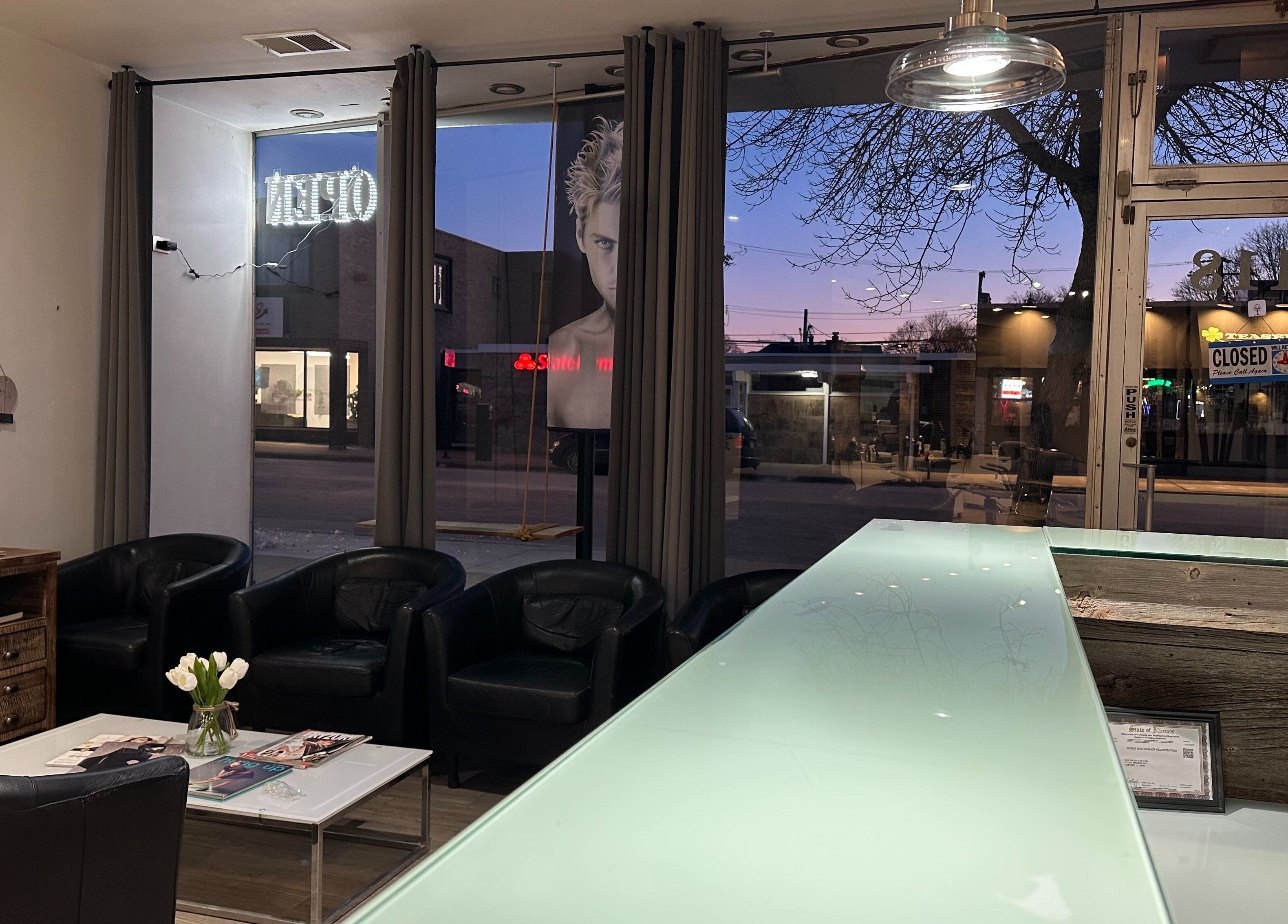 Chic waiting area at Eda Salon&Spa in Chicago, Illinois, US, featuring leather chairs and modern decor.