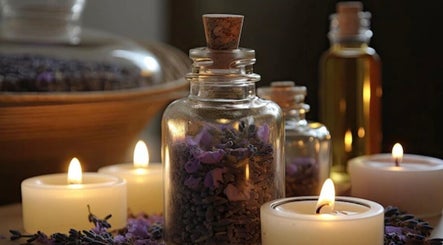 Tranquil candle-lit setup at Mandala Massage, Berkhamsted, England, GB with lavender and essential oils.