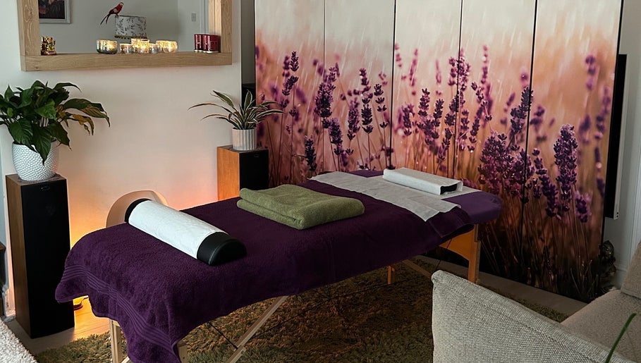Calming massage room at Mandala Massage, Berkhamsted, England, GB with lavender decor and cozy ambiance.