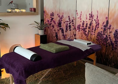 Calming massage room at Mandala Massage, Berkhamsted, England, GB with lavender decor and cozy ambiance.