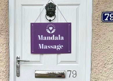 Entrance sign for Mandala Massage on a white door at 79, Berkhamsted, England, GB.