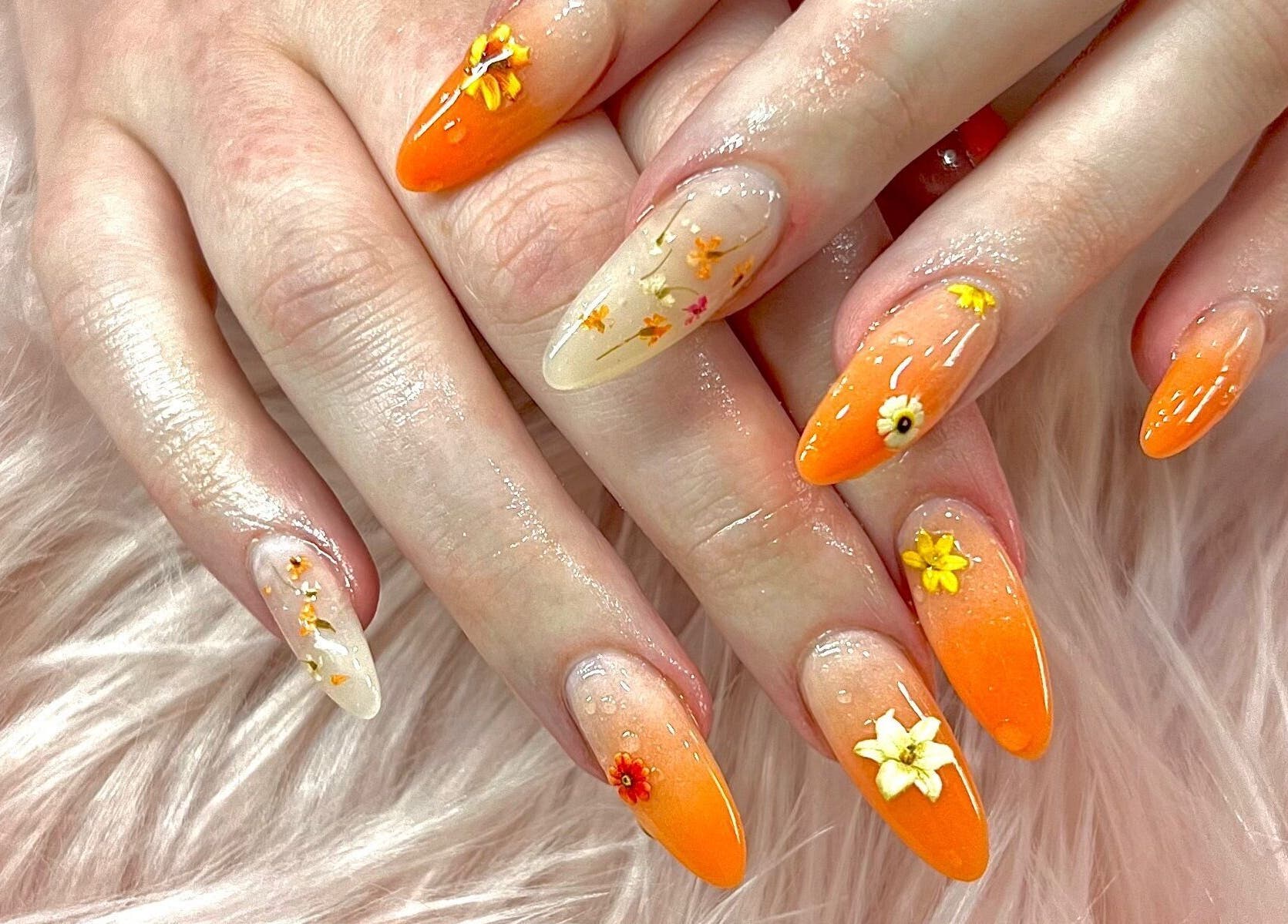 Floral orange nail art design at Jade Top Nails Hair Beauty Salon, Melbourne, Victoria, AU.