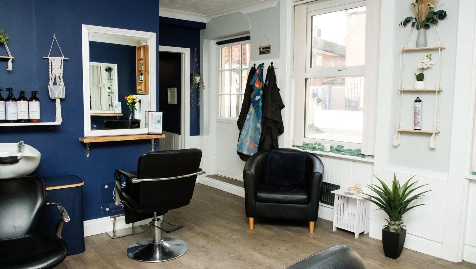 Interior of Blended Hair Studio in Dereham, England, GB, showcasing a modern salon setup with stylish decor.