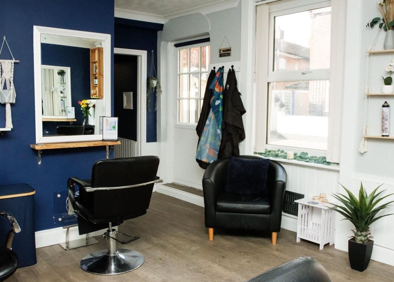 Interior of Blended Hair Studio in Dereham, England, GB, showcasing a modern salon setup with stylish decor.