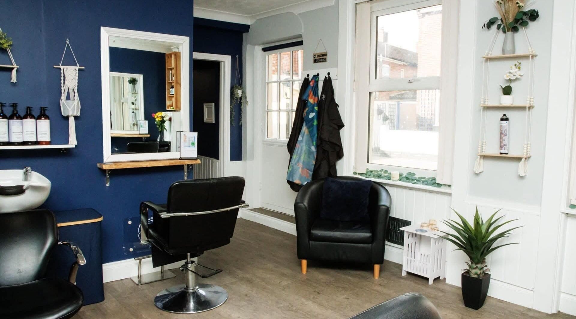 Interior of Blended Hair Studio in Dereham, England, GB, showcasing a modern salon setup with stylish decor.