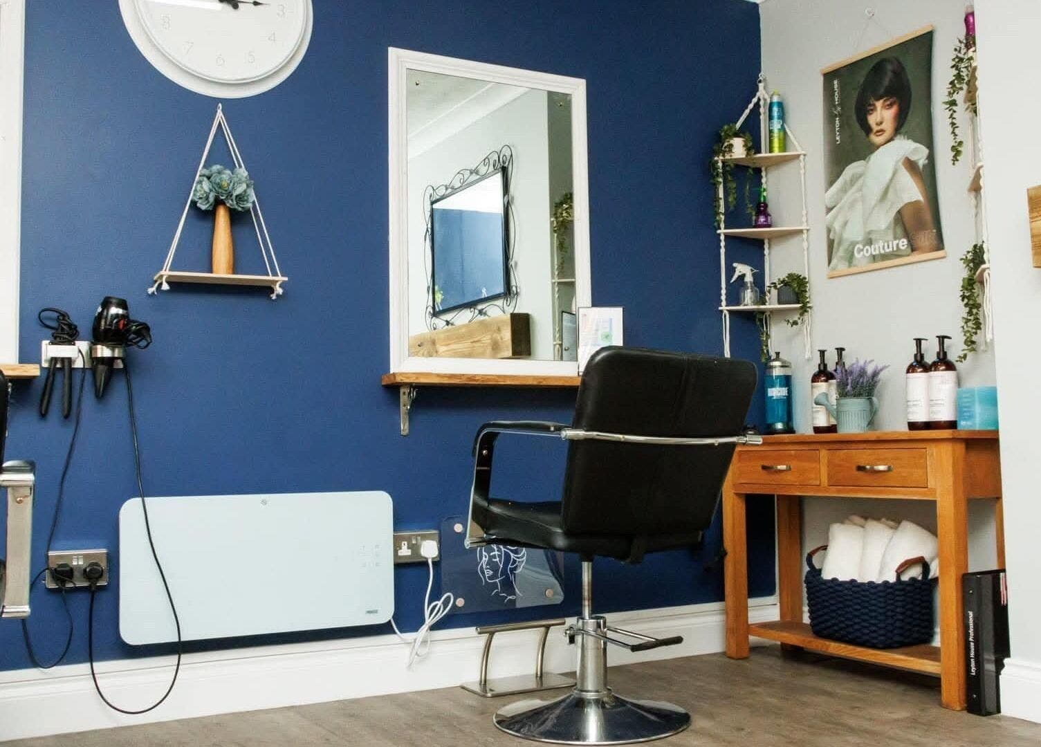 Stylish interior of Blended Hair Studio in Dereham, England featuring salon chairs and modern decor.