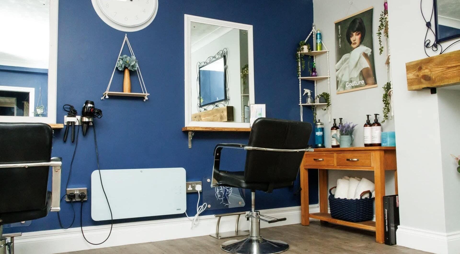 Stylish interior of Blended Hair Studio in Dereham, England featuring salon chairs and modern decor.