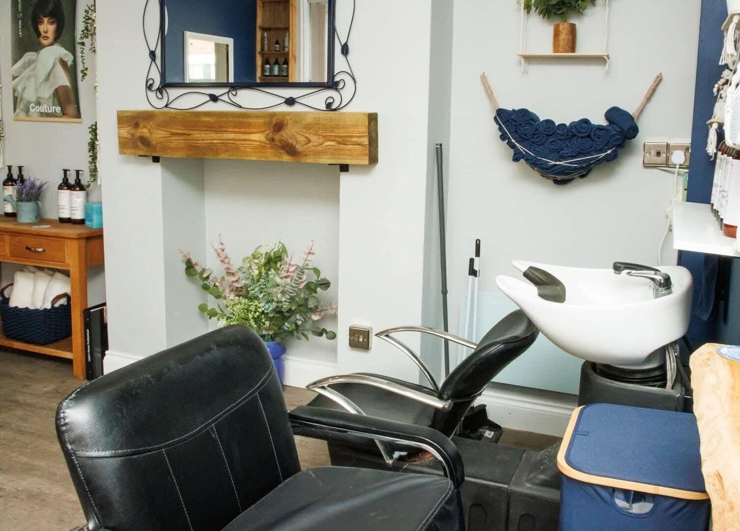 Modern salon interior at Blended Hair Studio in Dereham, England, GB, featuring stylish decor and wash stations.