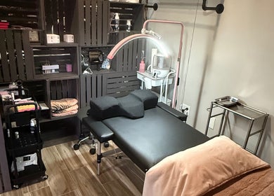 Treatment area with massage table at Shannan’s Beauty Bar, Tiverton, Rhode Island, US.