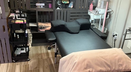 Relaxing treatment room at Shannan’s Beauty Bar in Tiverton, Rhode Island, US, showcasing a comfortable setup.