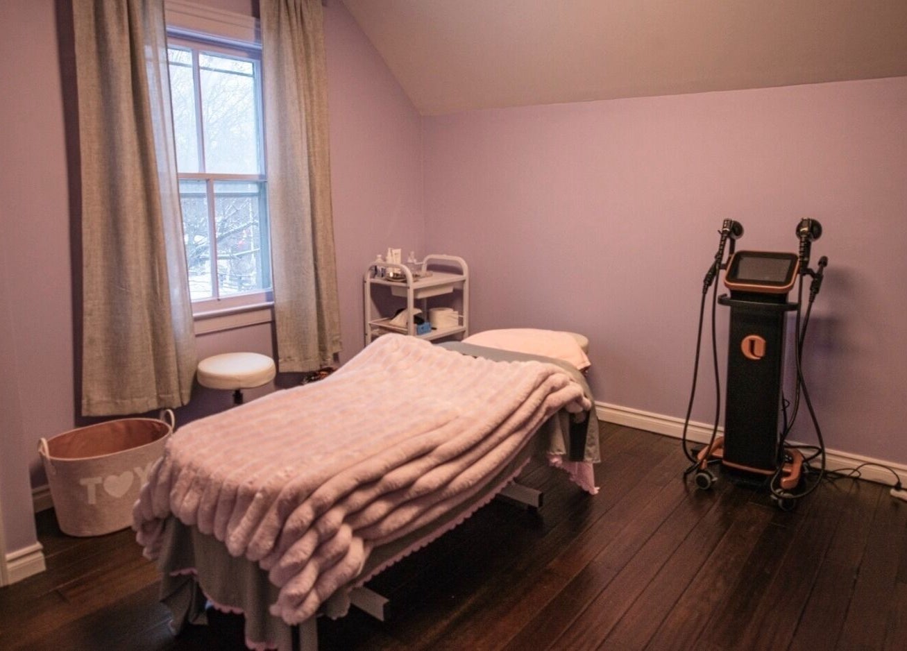 Cozy treatment room at Times Aesthetic, Markham, Ontario, CA with a massage table and soothing decor.