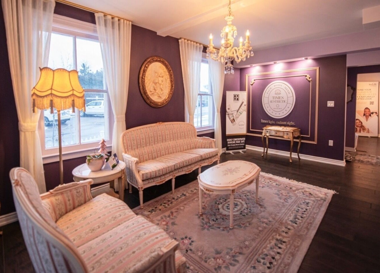 Chic waiting area at Times Aesthetic, Markham, Ontario, CA featuring plush seating and vintage decor.